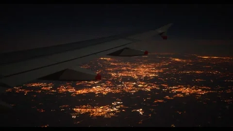 View from Plane over City Lights Flashing Red Light on Wing Vídeos de archivo 221867132
