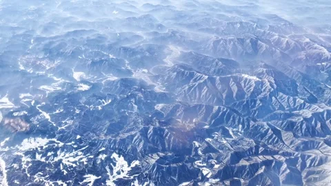 View from the plane to the snow covered mountains. 스톡 동영상 263919951