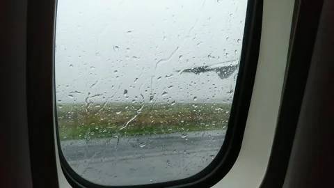 View from the plane through the window with rain drops. Stock Footage 274460925