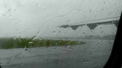 View from the plane through the window with rain drops Stock Footage 274460976