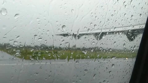 View from the plane through the window with rain drops. Stock Footage 274653755