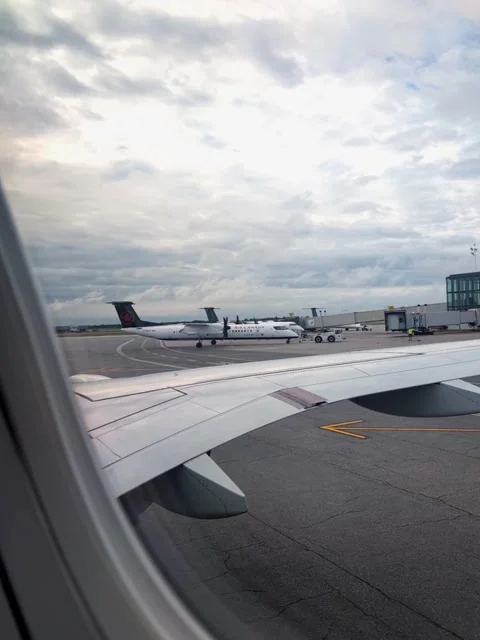 View from the plane  tow truck is taking it to the gate Video stock 329824982