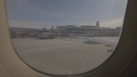 View of Plane Waiting at Terminal from Inside the Plane Video stock 147694569
