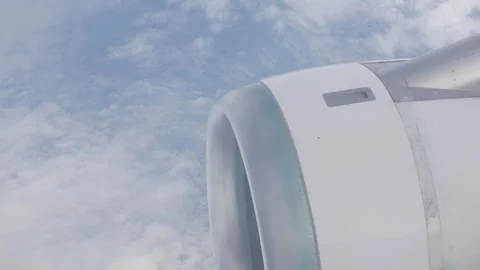 View from plane window of airplane engine while airplane flying over sky. 스톡 동영상 321288481