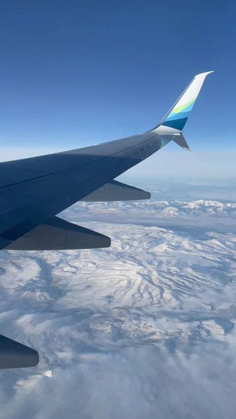 View from the plane window of Alaska Airlines to the landscape and wing, on the Stock Footage 235662134