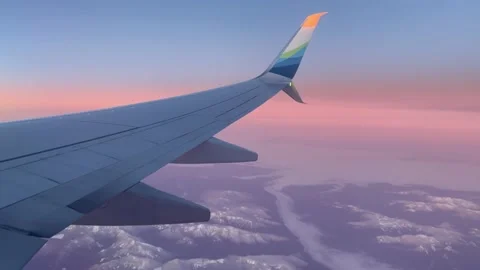 View from the plane window of Alaska Airlines to the landscape and wing, on the Stock Footage 235662149