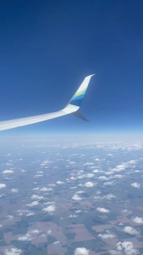 View from the plane window of Alaska Airlines to the landscape and wing, on the Stock Footage 277475689