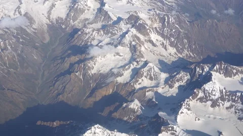 The view from plane window to clouds and mountains 動画素材 282674027