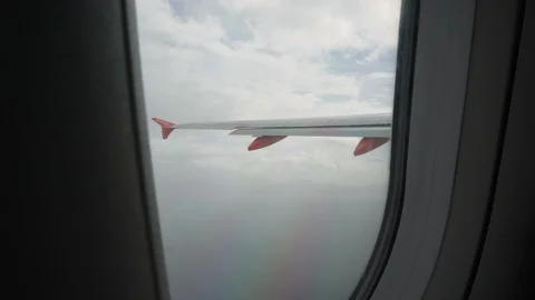 View from the plane window on the cloudy sky Video stock 108223392