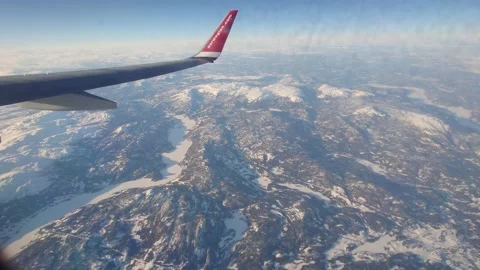 View from the Plane Window Flying Over Mountains 4k Stock Footage 238896958