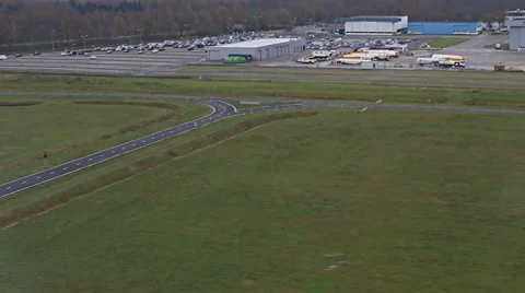 View from plane window to the ground, plane wings and landing airplane Vídeo Stock 58140637