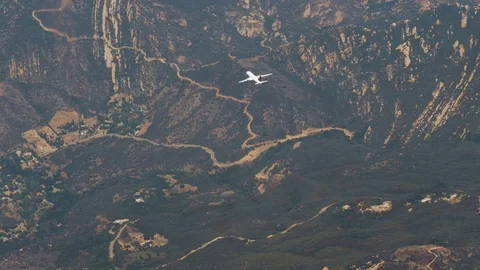 View From Plane Window Of A Near Fast Flying Passenger Plane Background Hills Stock Footage 126108722