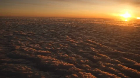 View from plane window sunshine clouds. Looking through window aircraft during Stock Footage 124398737