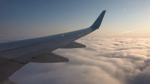 View from the plane window. Wing and sky in the window of the plane Stock Footage 120804460