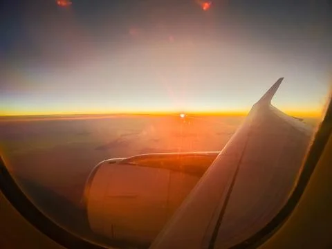 View from the plane window. Wing on the background of the sunset. The conce.. Stock Photos
