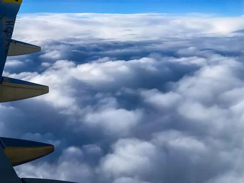 View from a plane window with wings Stock Photos
