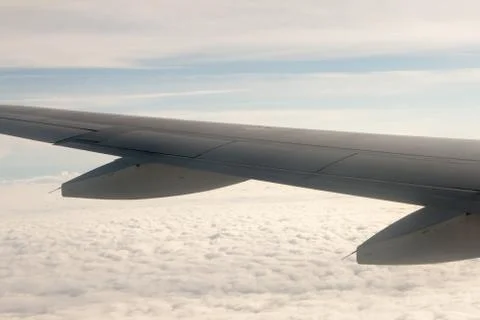 View from the plane on the wing and clouds Stock Photos