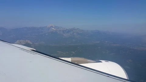 View from the plane on the wing and the mountains Stock Footage 101978440