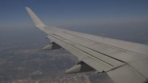 View Of Plane Wing Over The Horizon Below Video stock 118096111