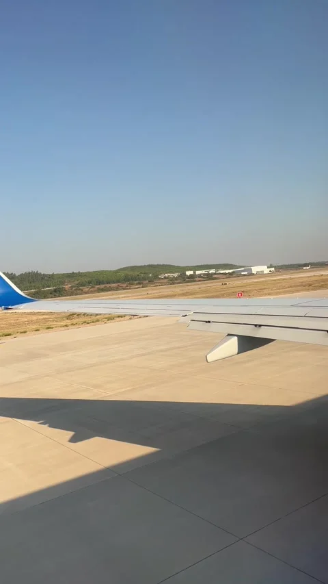 View of a plane wing that is taking off Stock Footage 337220745