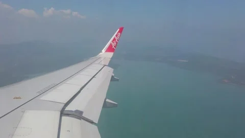 View of the plane wing through the airpl... | Stock Video | Pond5