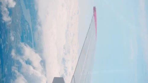 View of plane wing from window air travel vertical video. Air travel connects Video stock 263955328