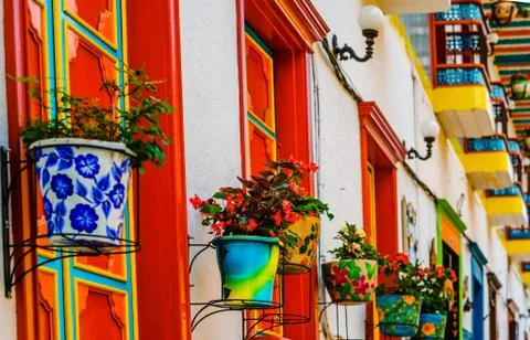 View on plants in front of colonial buildings of Jardin, Colombia Stock Photos