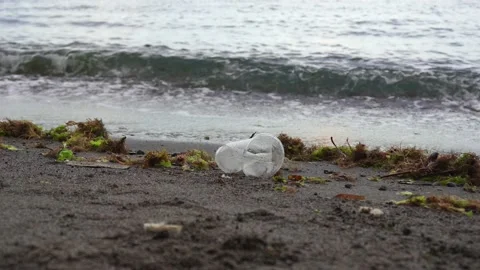 View at the plastic by the sea. A man walks past a plastic glass. Stock-Footage 133649701