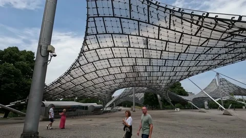 View on the plexiglass roofs of the olympic  area in Munich Stock Footage 238772821