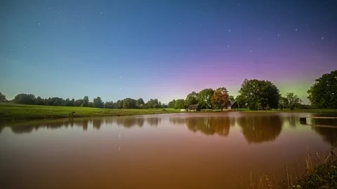 View of pond under aurora borealis in Riga, Latvia. 库存影片 341454221