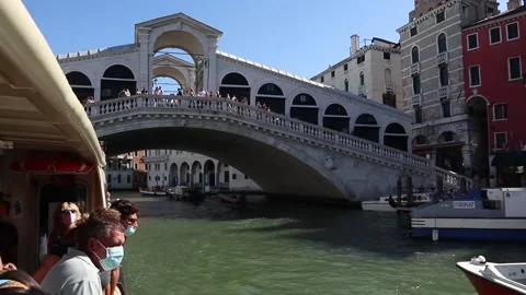 View of Ponte Rialto bridge from the Tragetto sailing on the Grand Canal, Venice Stock Footage