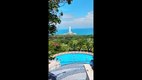 View of pool area and ocean from high location in sunny tropical setting during Video stock 327181800