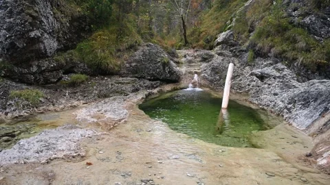 View of a pool from a mountain stream in autumn Video stock 260865220