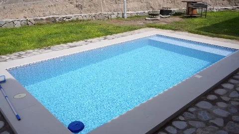View of a pool next to the grill in a country house between mountains in the day Video stock 199474741