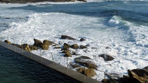 View from the pool side by the ocean Stock Photos