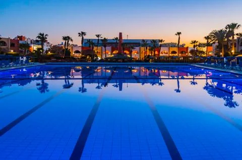 View of a pool at sunset with reflections Stock Photos