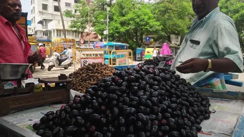 A view of popular Indian Java plum fruits kept on a pushcart for sale Video stock 243577895