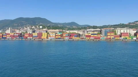 A view from port of Florence colourful containers green mountains and town Stock Footage 197301404