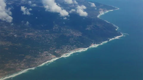 View from the porthole of an airplane. Clouds over Atlantic Ocean. Stock Footage 120116064