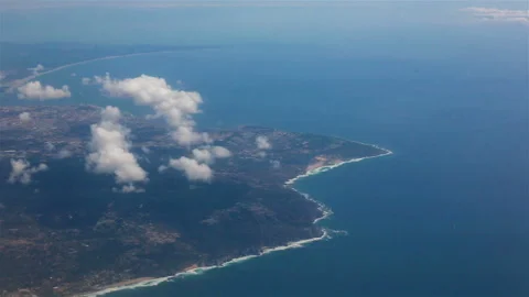 View from the porthole of an airplane. Clouds over Atlantic Ocean. Stock Footage 120993674
