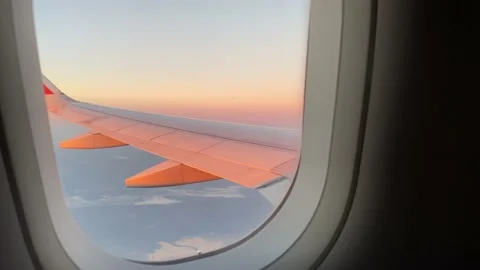 View from the porthole flight by plane sunset from the porthole Video stock 232169059