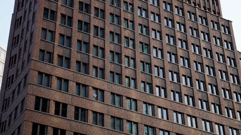View of Potsdamer Platz buildings, pan shot of old and modern glass building. 動画素材 116257948