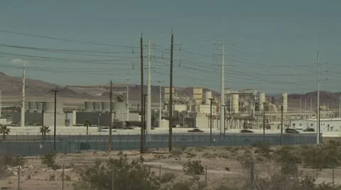 View of Power Plant with Freeway in Foreground and Mountains in the Horizon Video stock 19000075