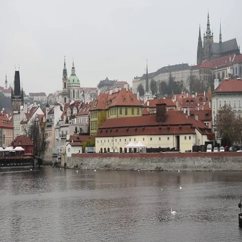 View of Prague Castle and the Vltava river, boats and birds pass by Stock Footage
