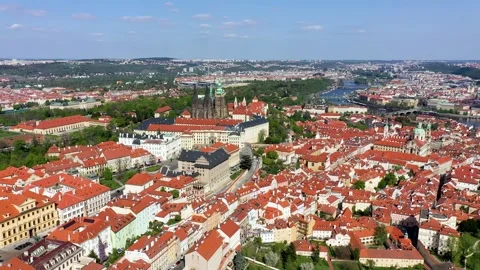 View of Prague featuring historic castle and vibrant rooftops on a sunny da.. Stock Footage 326915102