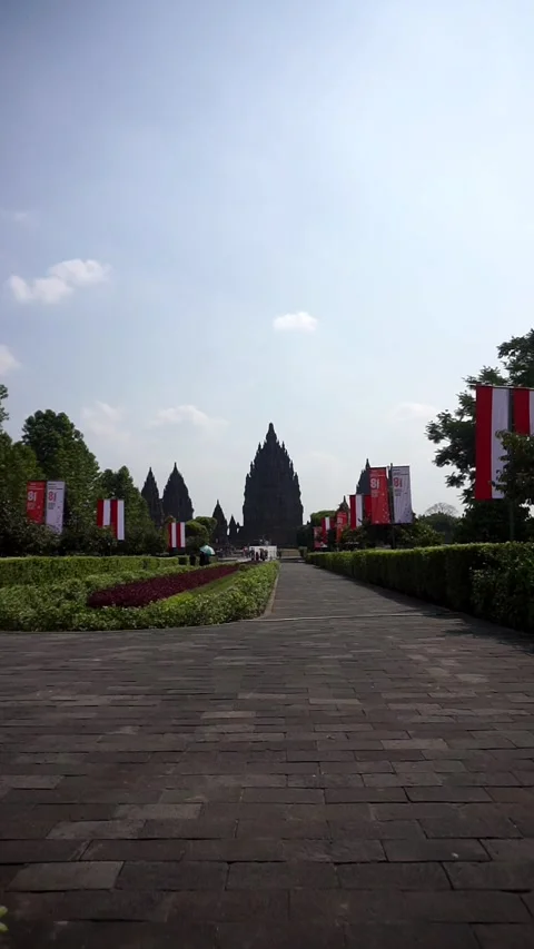 View of Prambanan Temple decorated with red and white banners along the park Stock-Footage 342688520