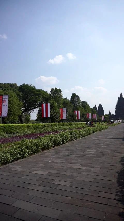 View of Prambanan Temple decorated with red and white banners along the park Stock-Footage 342688523