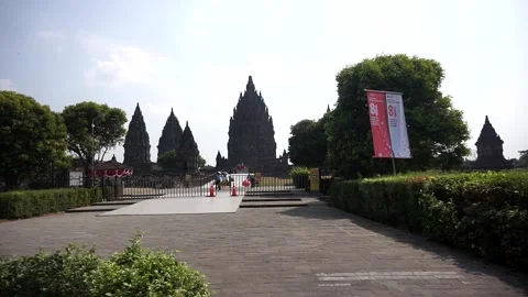 View of Prambanan Temple decorated with red and white banners along the park Stock-Footage 342689313