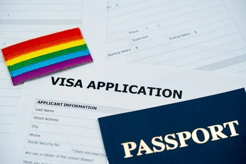 View of pride flag patch on visa application form with passport Stockfoto's