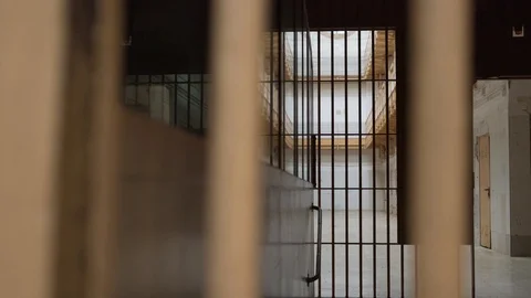 View of the prison corridor through the bars. Stock Footage 120039540